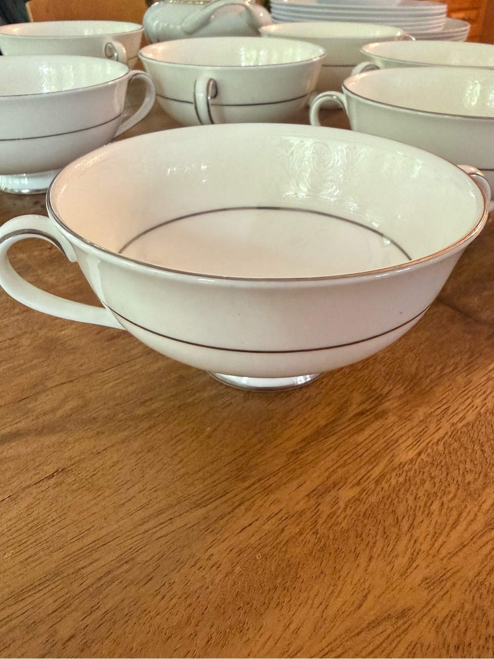 Elegant Cream Porcelain Tea Cup with Silver Trim - Setpiece